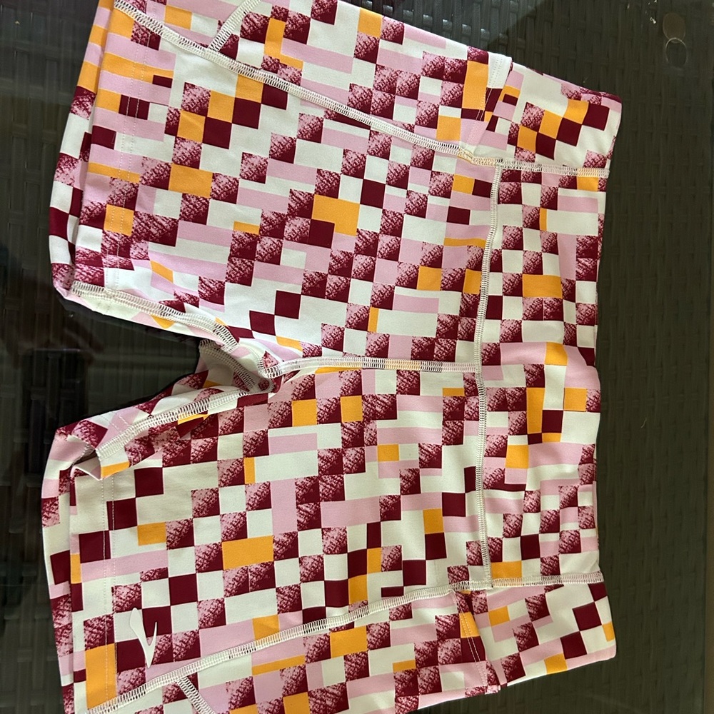 Colorful Geometric Patterned Shorts and matching hat.